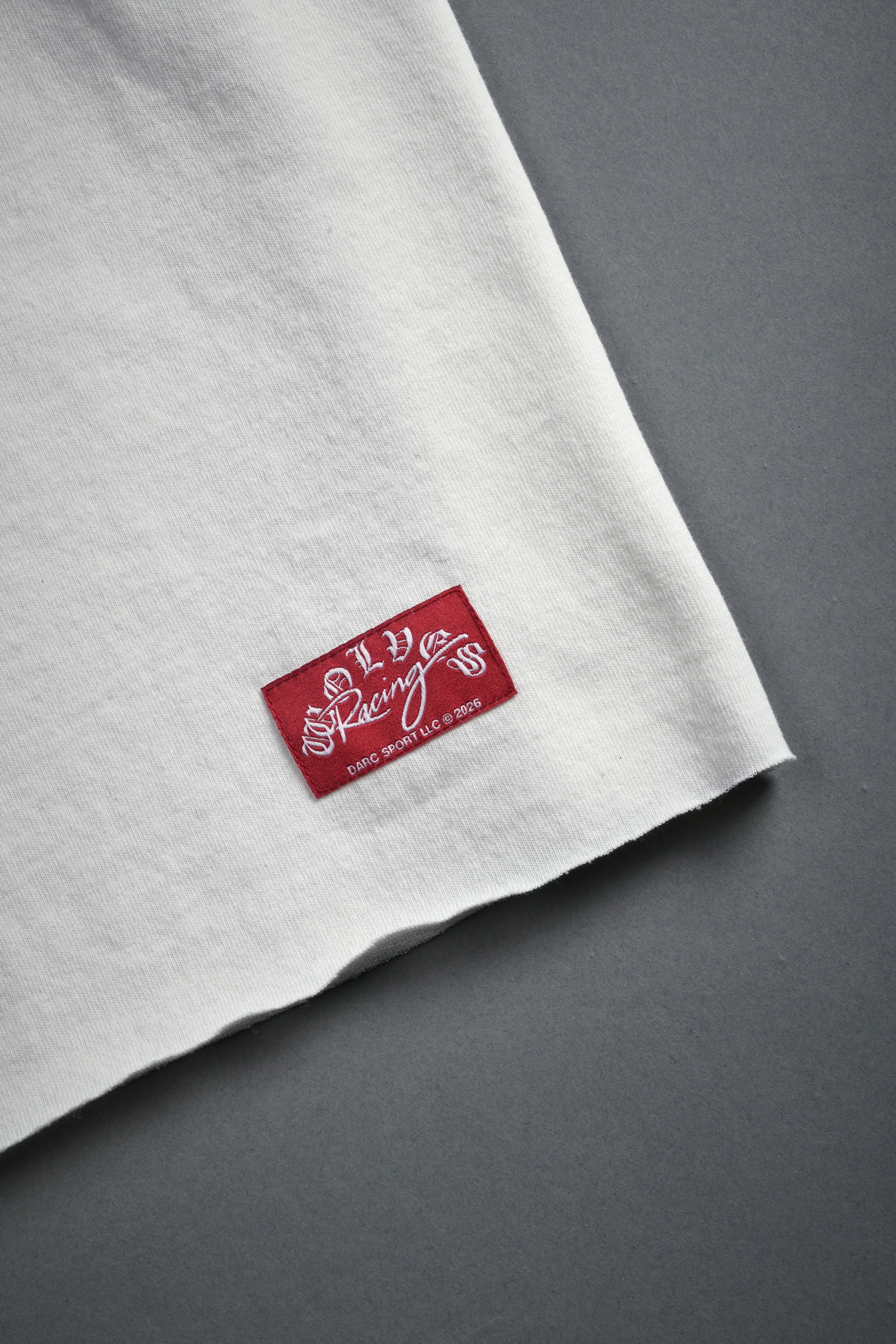Darc Racer Grunge Mid Length Raw Hem Tee in Cream - Image 5